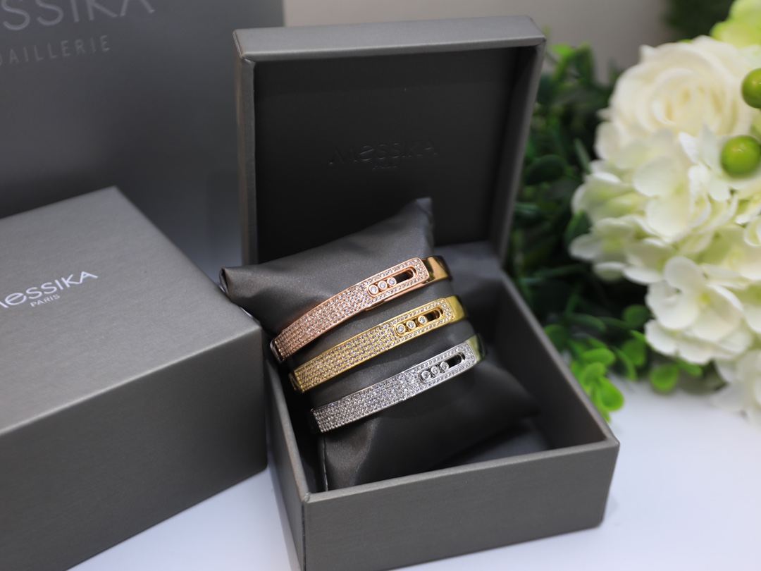 Messika Move Series Pave Bangle bracelet Available in 18k rose gold 18k yellow gold 18k white gold all set with pave white diamonds and three sliding brilliant-cut white diamonds 17cm inner circumference