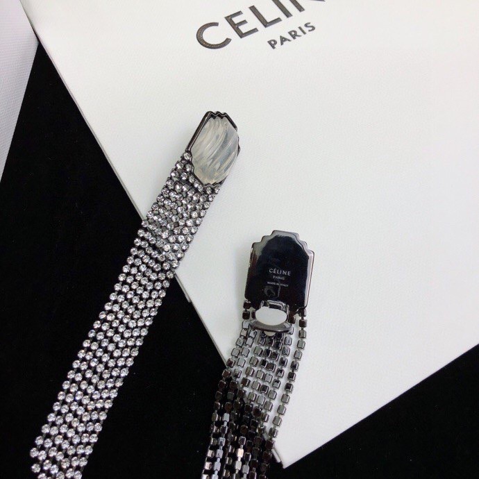 Celine Carved Stone Multi-Strand Crystal Tassel Earrings earrings Gunmetal-toned dark metal pale translucent carved stone clear faceted crystals 9cm length