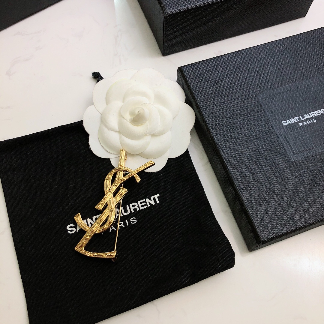 Saint Laurent Cassandre Bamboo YSL Monogram brooch gold tone metal no gemstones 4 5cm height