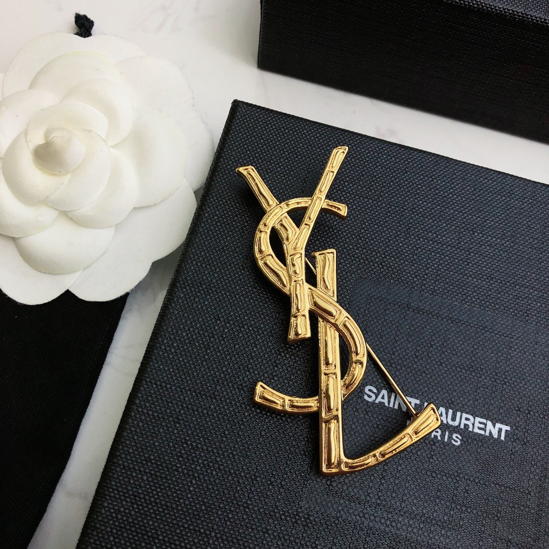 Saint Laurent Cassandre Bamboo YSL Monogram brooch gold tone metal no gemstones 4 5cm height