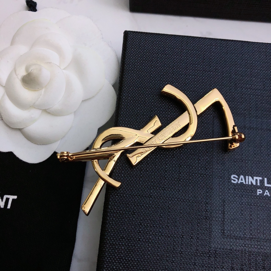 Saint Laurent Cassandre Bamboo YSL Monogram brooch gold tone metal no gemstones 4 5cm height