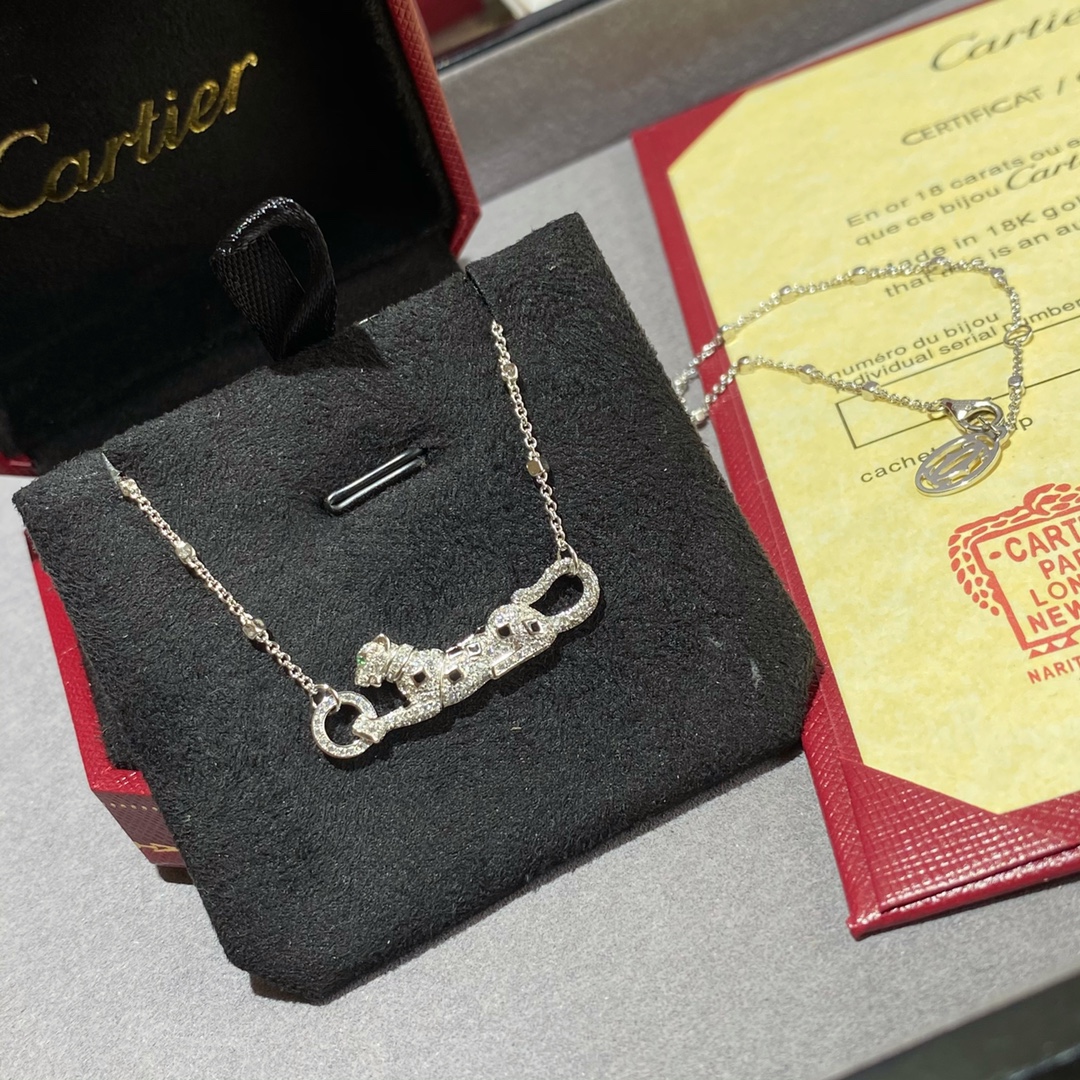 Cartier Panthere de Cartier necklace 18k white gold set with white diamonds black onyx spots green tsavorite garnet eye 42cm