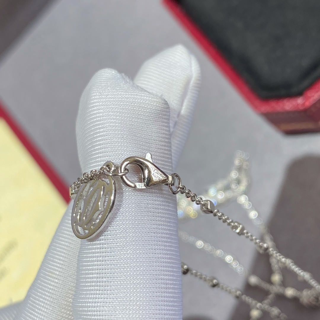 Cartier Panthere de Cartier necklace 18k white gold set with white diamonds black onyx spots green tsavorite garnet eye 42cm