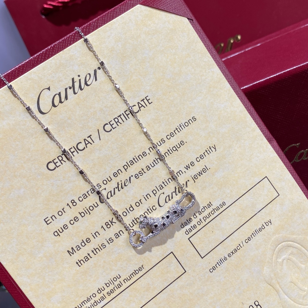 Cartier Panthere de Cartier necklace 18k white gold set with white diamonds black onyx spots green tsavorite garnet eye 42cm