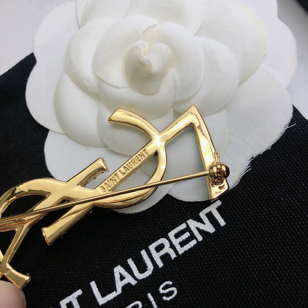 Saint Laurent 05038100 YSL Monogram brooch Gold-tone metal black enamel clear crystal pave 4 5cm width
