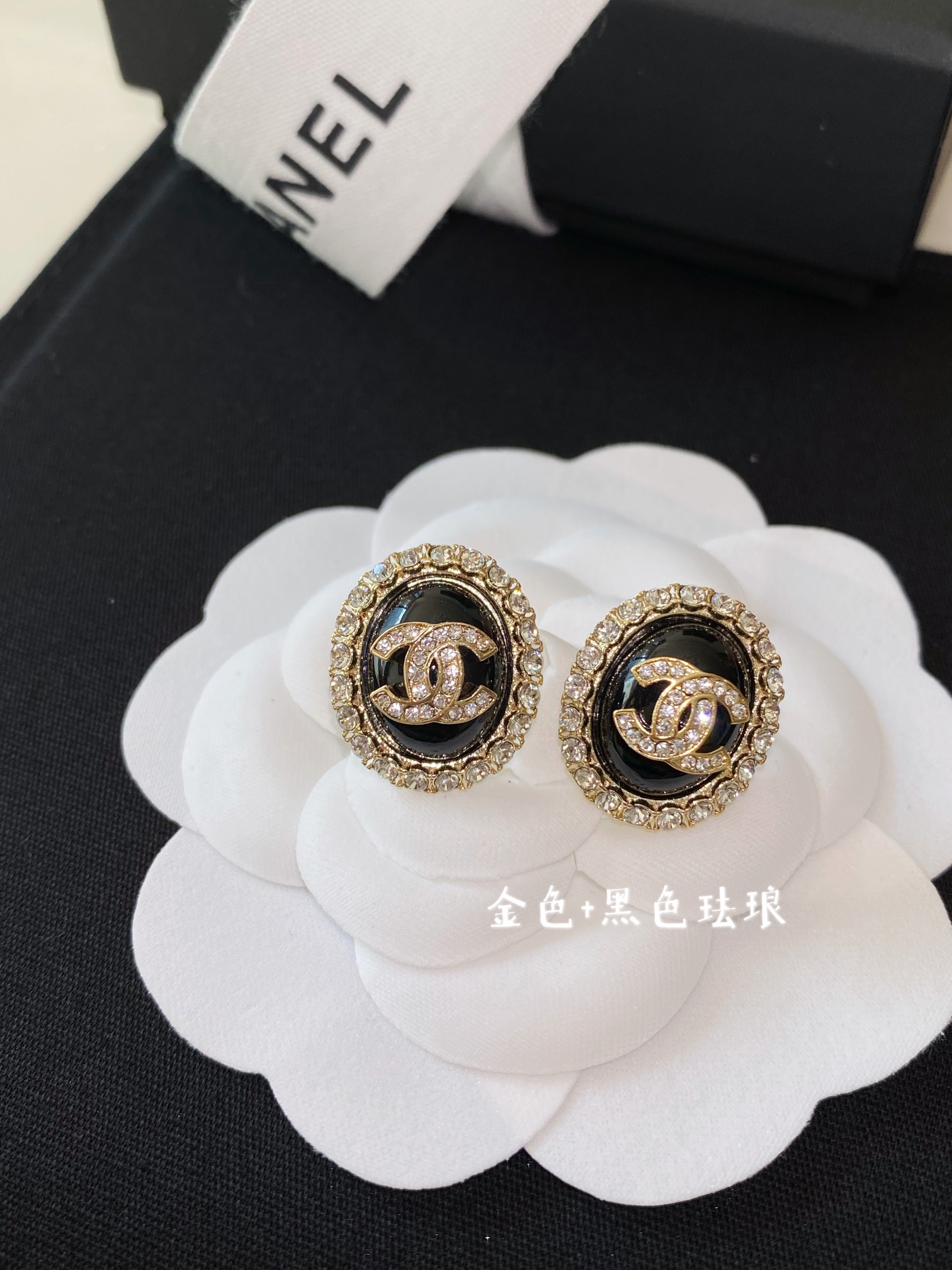 Chanel earrings Gold-tone metal with clear crystals available in cream pearl and black resin center options 1 5cm diameter