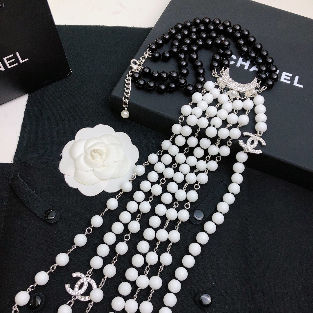 Chanel Baroque Crescent Moon CC Logo necklace silver tone metal black resin beads white resin beads clear crystal accents 42cm with 5cm extender chain