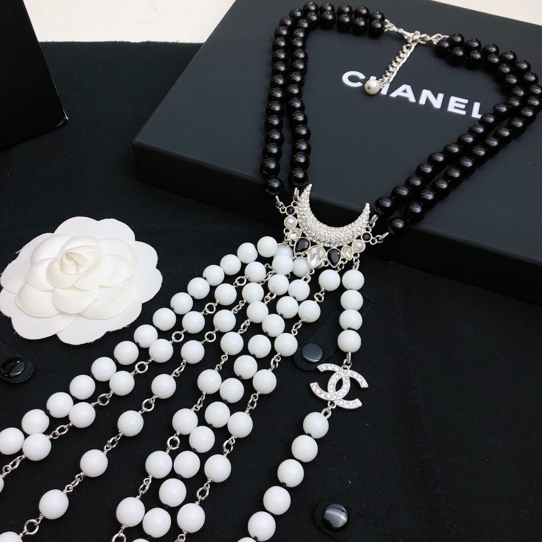 Chanel Baroque Crescent Moon CC Logo necklace silver tone metal black resin beads white resin beads clear crystal accents 42cm with 5cm extender chain