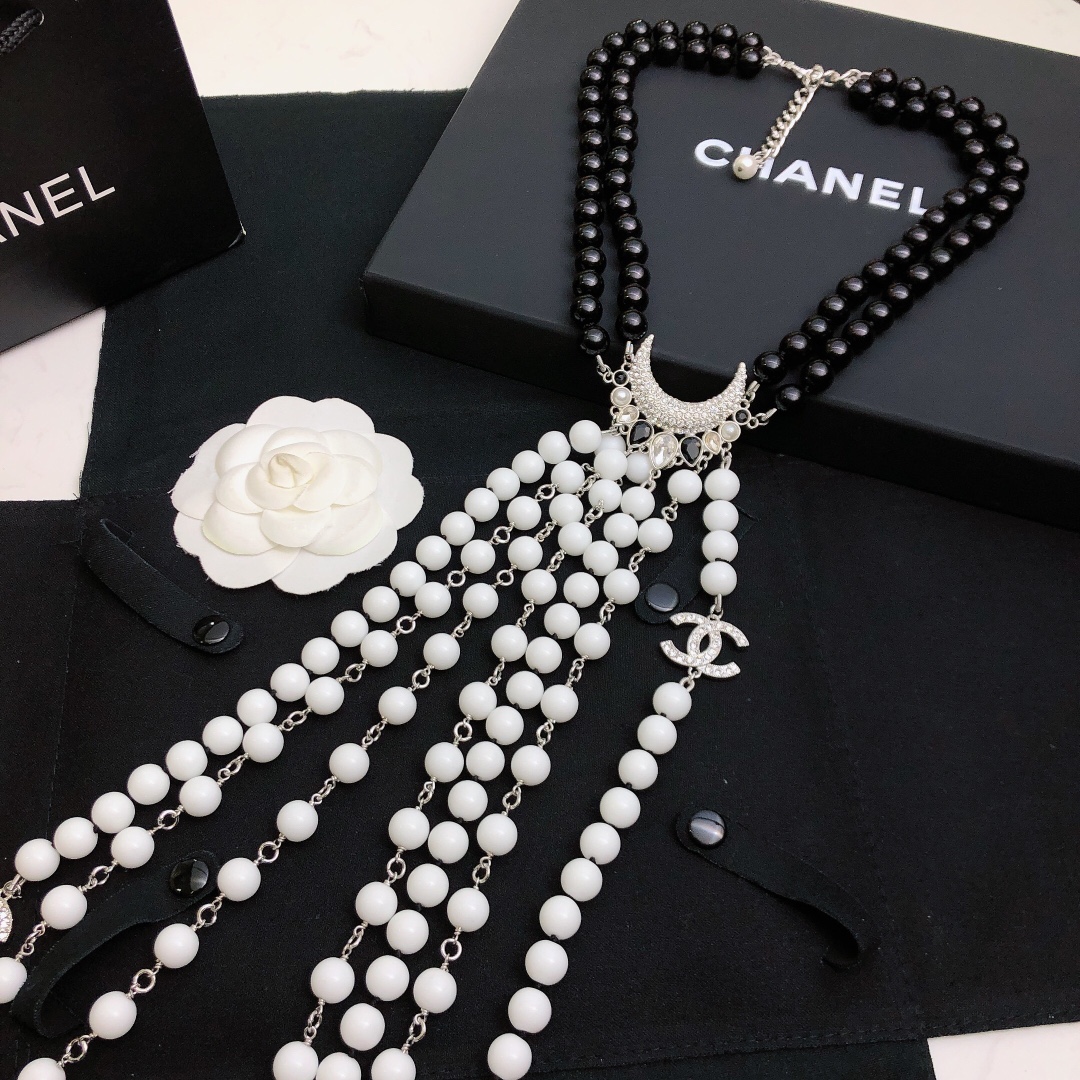 Chanel Baroque Crescent Moon CC Logo necklace silver tone metal black resin beads white resin beads clear crystal accents 42cm with 5cm extender chain
