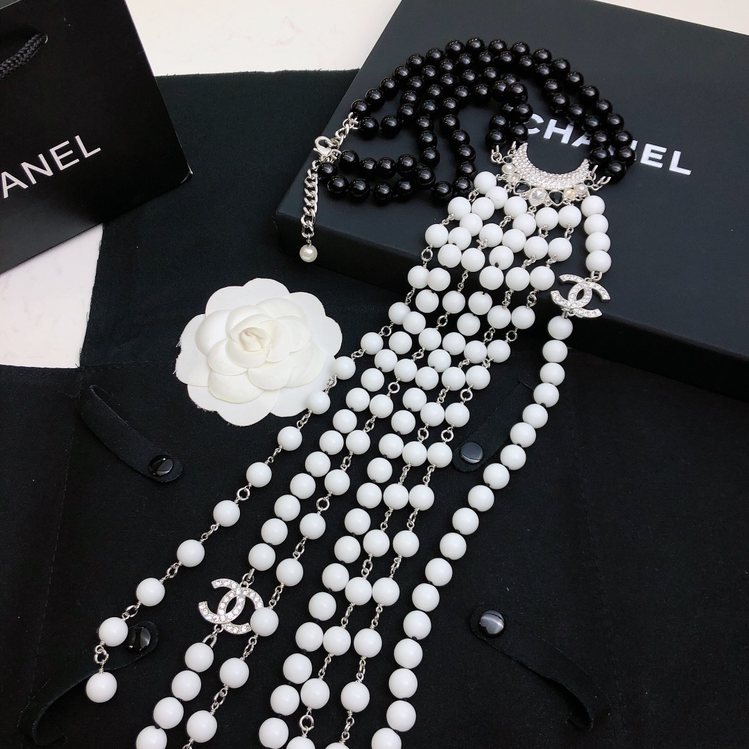Chanel Baroque Crescent Moon CC Logo necklace silver tone metal black resin beads white resin beads clear crystal accents 42cm with 5cm extender chain