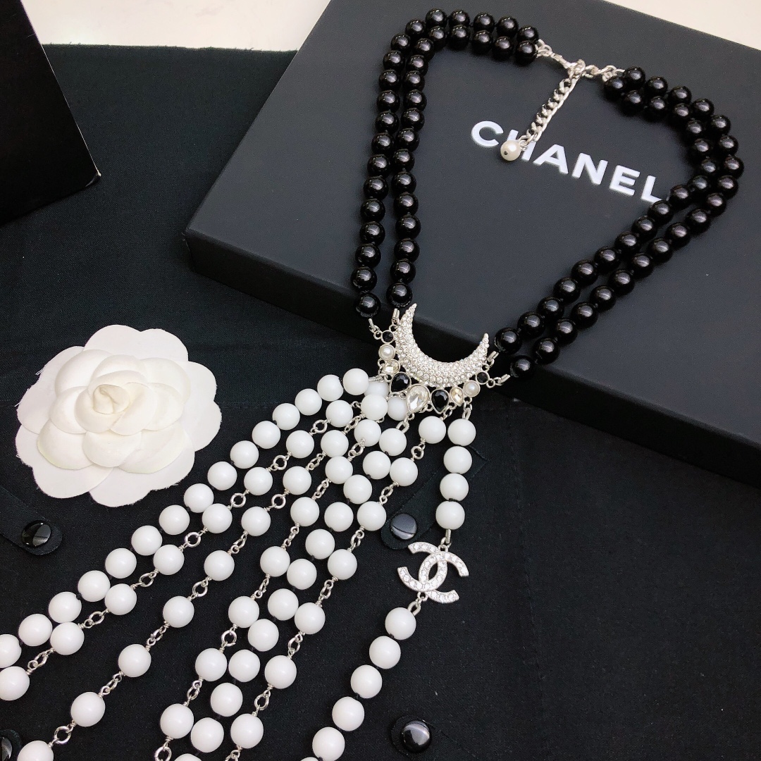 Chanel Baroque Crescent Moon CC Logo necklace silver tone metal black resin beads white resin beads clear crystal accents 42cm with 5cm extender chain