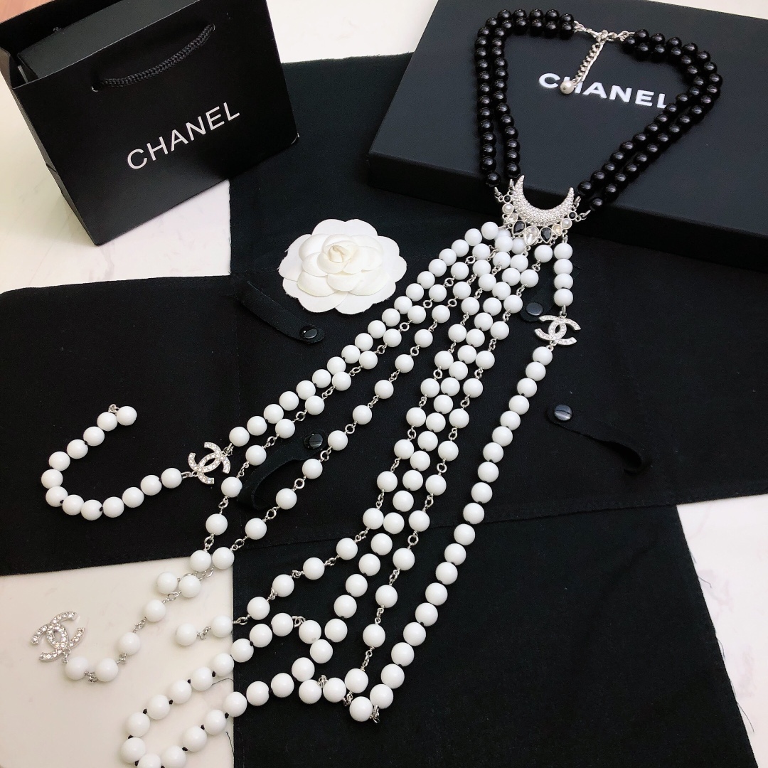 Chanel Baroque Crescent Moon CC Logo necklace silver tone metal black resin beads white resin beads clear crystal accents 42cm with 5cm extender chain