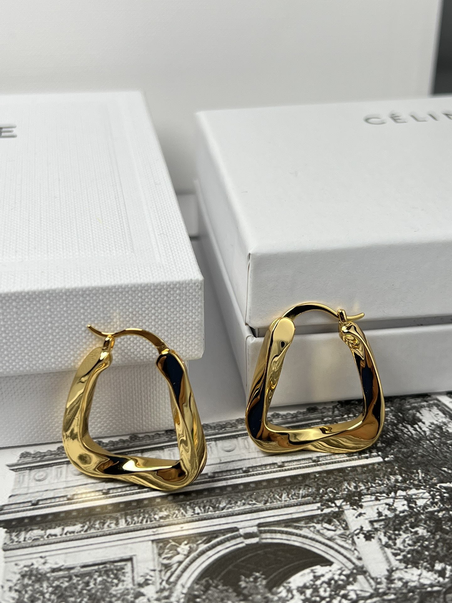 Celine YHEH055 Twisted Square Hoop earrings polished gold tone metal no accent stones 2 5cm hoop diameter