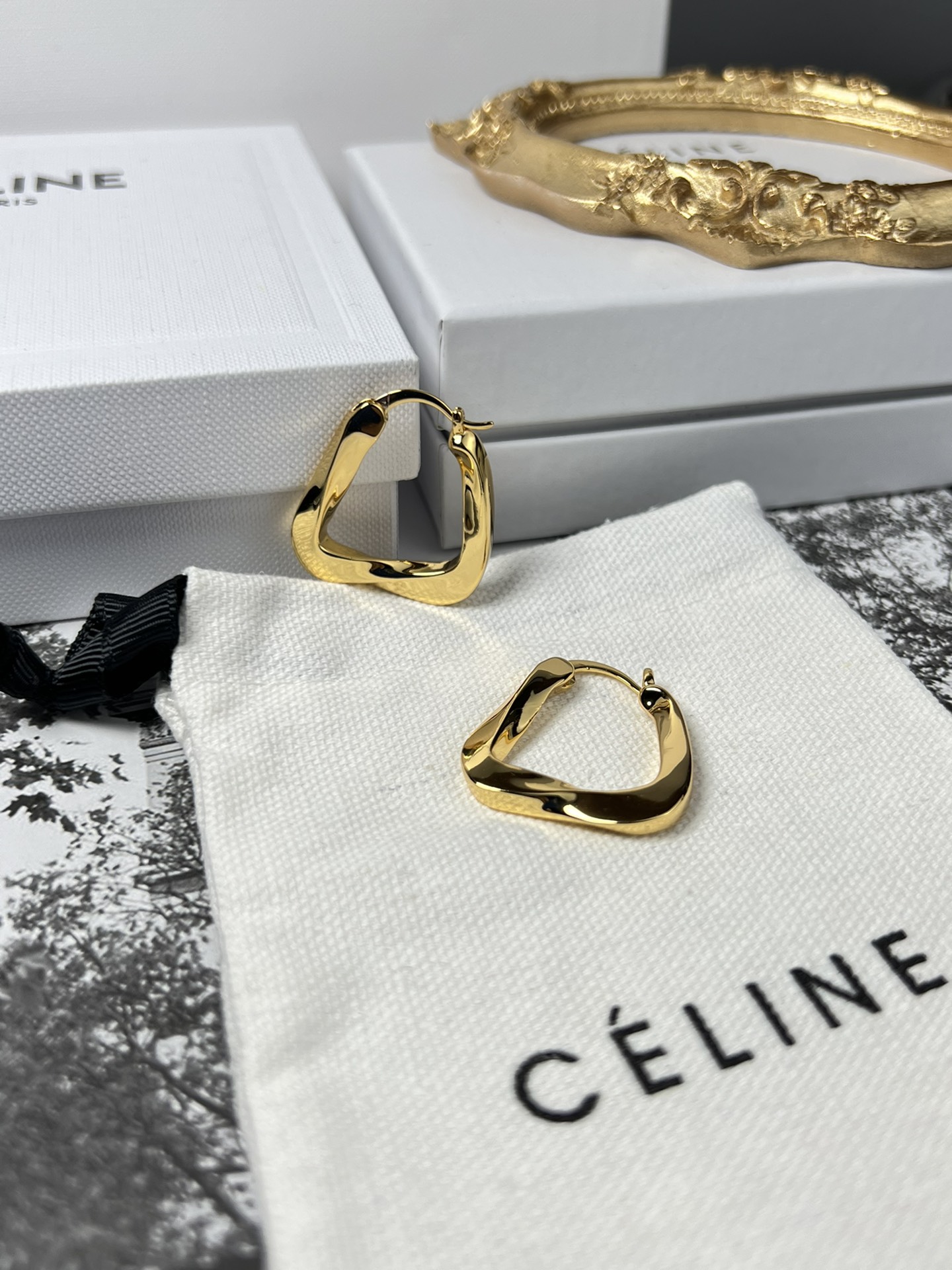 Celine YHEH055 Twisted Square Hoop earrings polished gold tone metal no accent stones 2 5cm hoop diameter