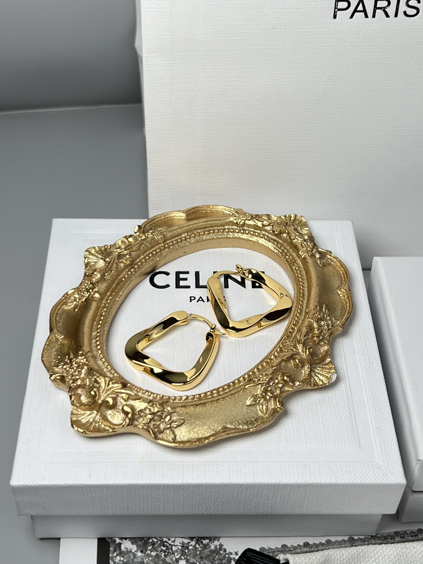 Celine YHEH055 Twisted Square Hoop earrings polished gold tone metal no accent stones 2 5cm hoop diameter