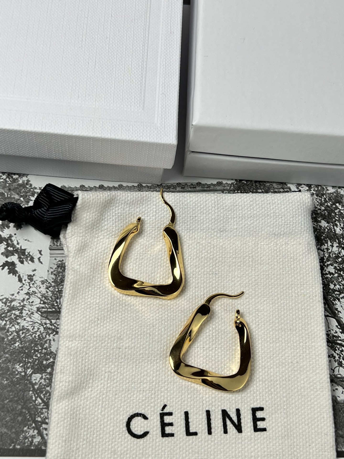 Celine YHEH055 Twisted Square Hoop earrings polished gold tone metal no accent stones 2 5cm hoop diameter