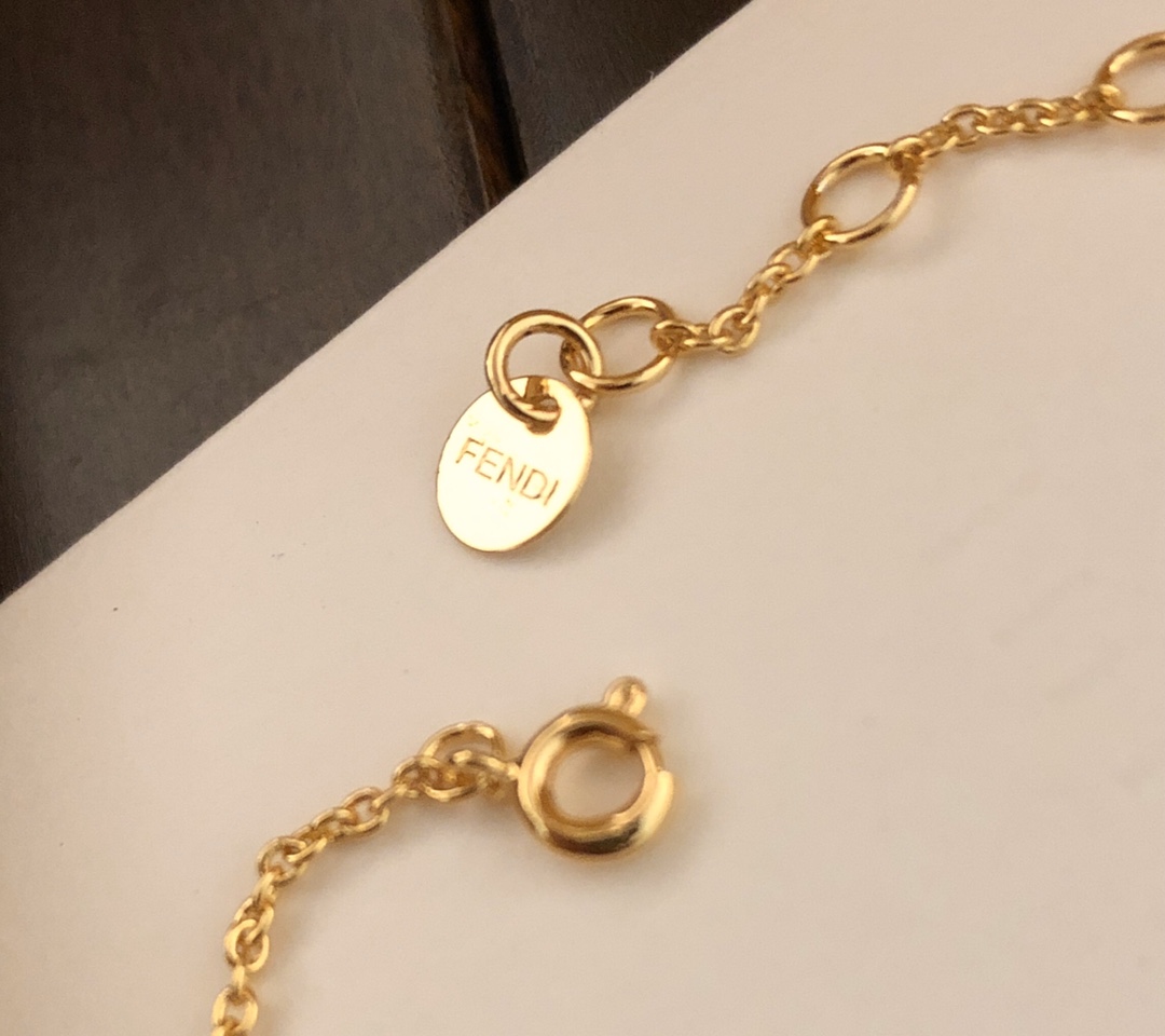 Fendi FENDI Letter Charm Bracelet bracelet gold-tone metal with clear cubic zirconia stones 18cm