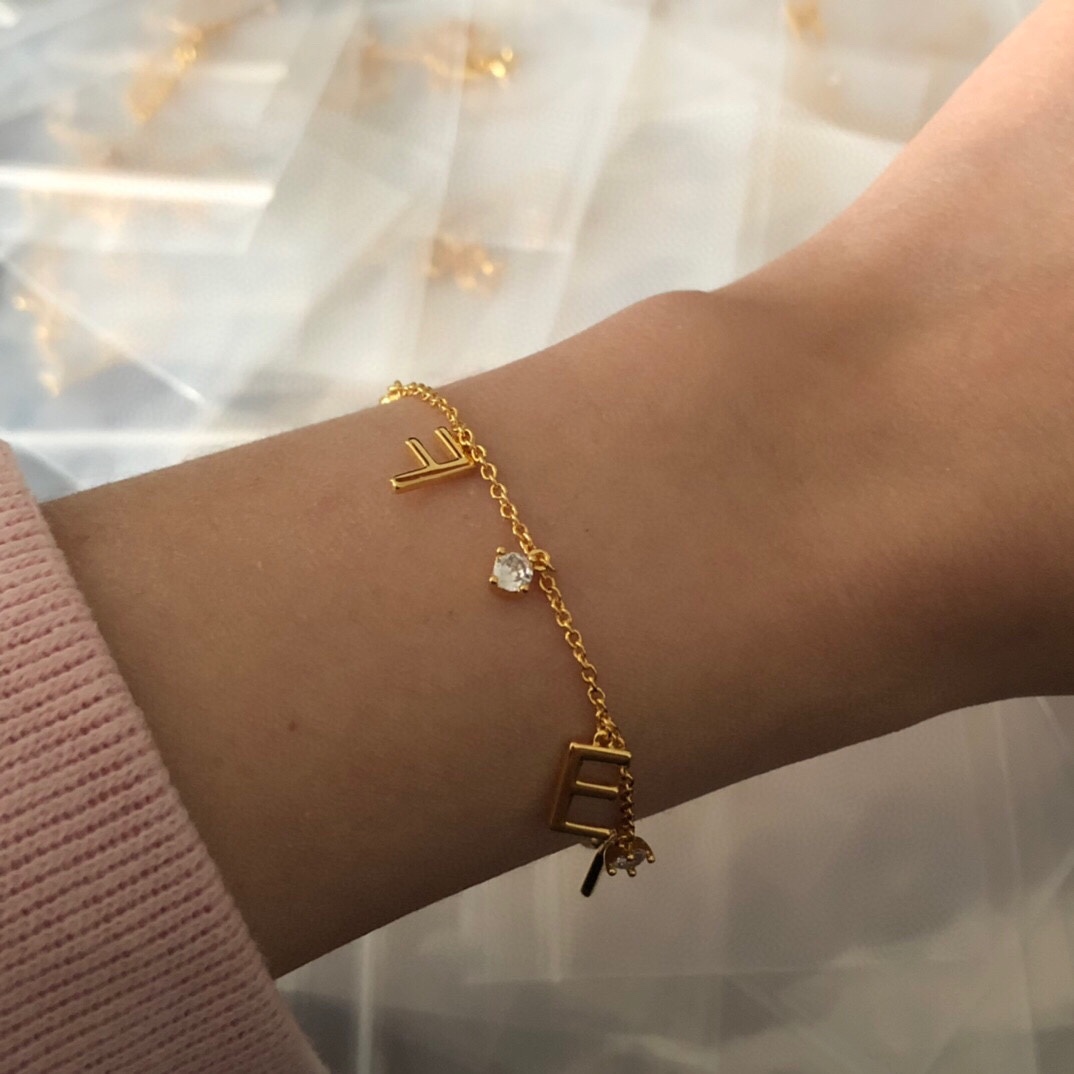 Fendi FENDI Letter Charm Bracelet bracelet gold-tone metal with clear cubic zirconia stones 18cm