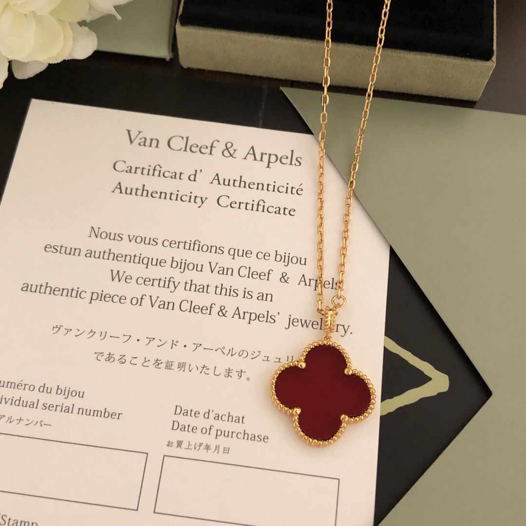 Van Cleef Arpels Magic Alhambra necklace 18k yellow gold with carnelian and malachite clover motifs 25mm pendant