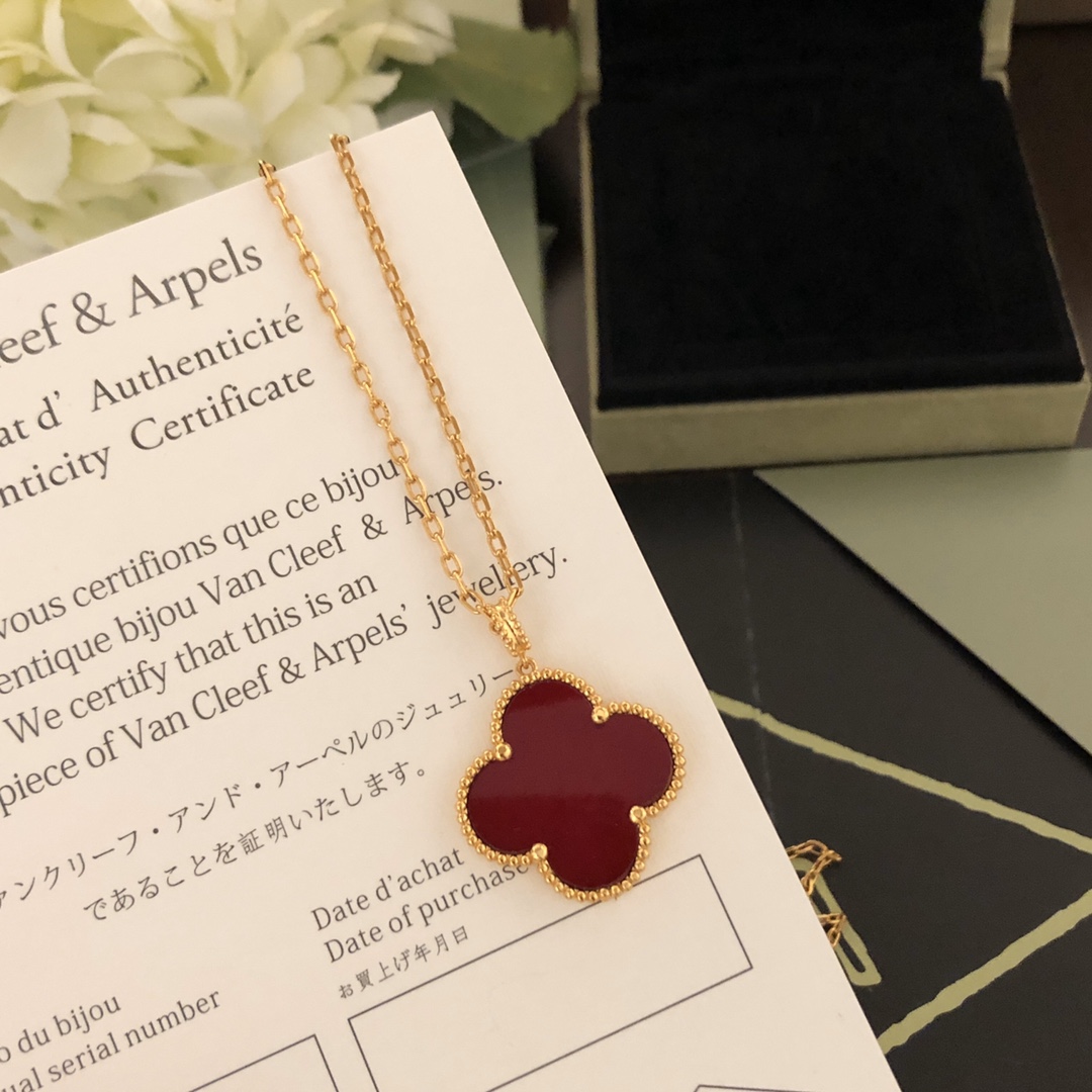 Van Cleef Arpels Magic Alhambra necklace 18k yellow gold with carnelian and malachite clover motifs 25mm pendant