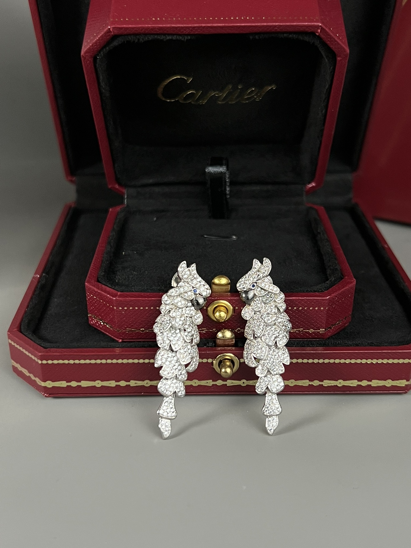 Cartier Les Oiseaux Liberes Parrot earrings 18k white gold pave set white diamonds blue sapphire eyes black rhodium plated beaks 4 8cm length
