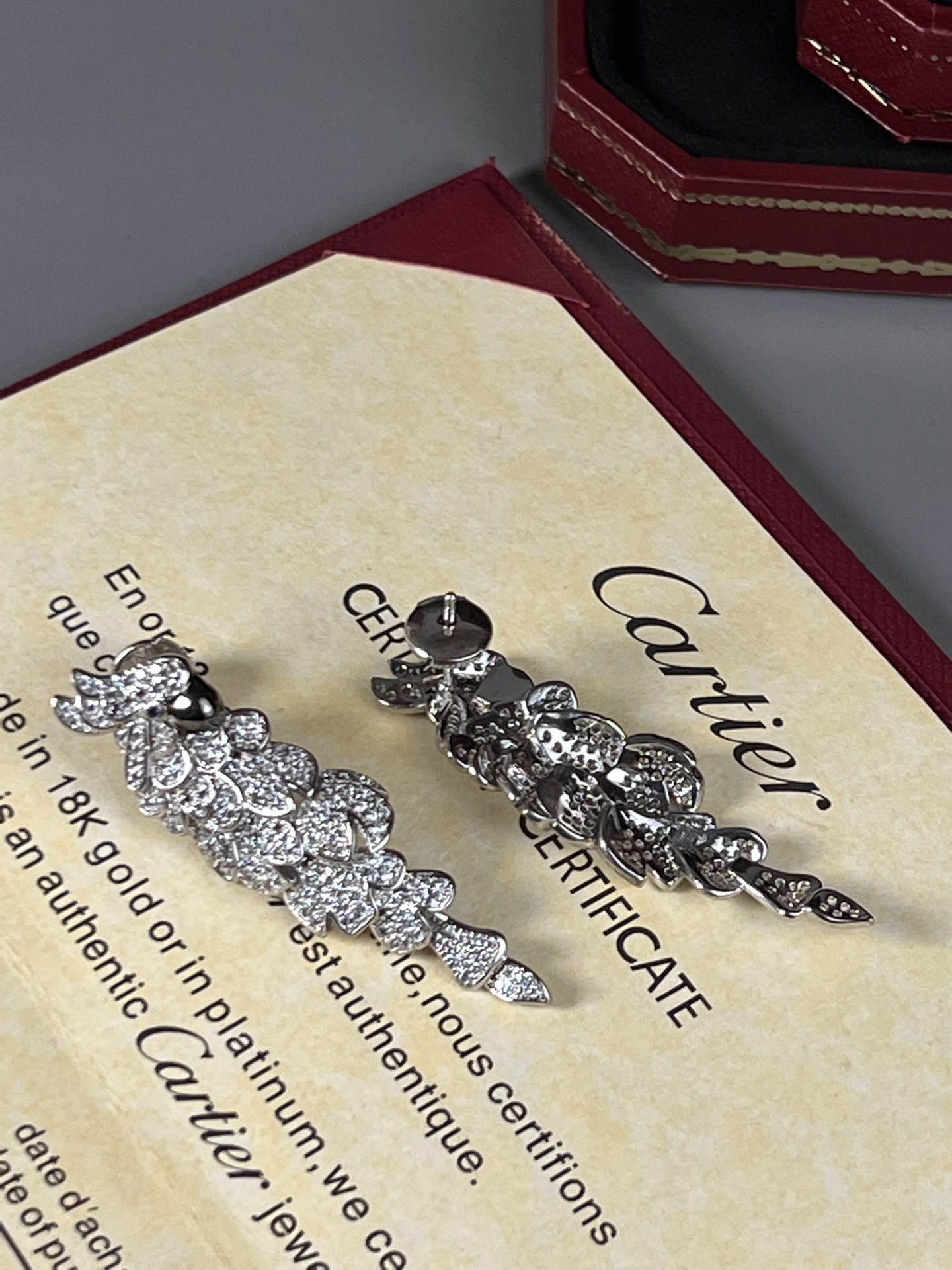 Cartier Les Oiseaux Liberes Parrot earrings 18k white gold pave set white diamonds blue sapphire eyes black rhodium plated beaks 4 8cm length