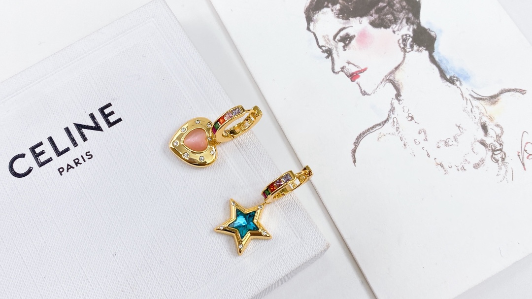 Celine Asymmetric Heart Star Rainbow Crystal Huggie Earrings earrings Gold-tone metal with multicolor rainbow crystals pink opal-style heart stone blue crystal star and clear accent crystals 12mm hoop diameter 20mm total drop length