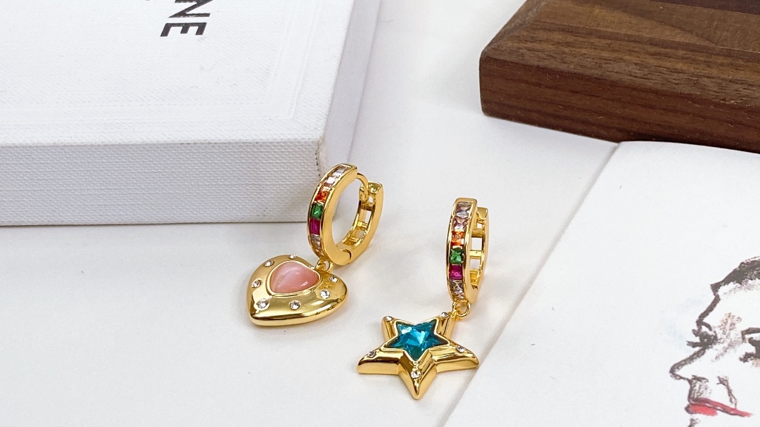 Celine Asymmetric Heart Star Rainbow Crystal Huggie Earrings earrings Gold-tone metal with multicolor rainbow crystals pink opal-style heart stone blue crystal star and clear accent crystals 12mm hoop diameter 20mm total drop length