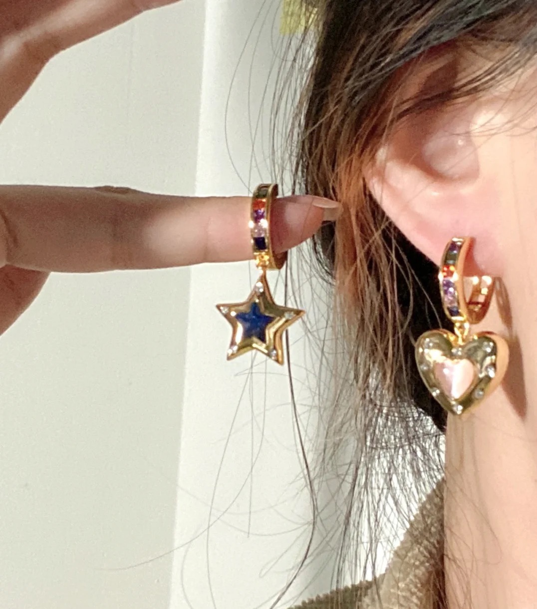 Celine Asymmetric Heart Star Rainbow Crystal Huggie Earrings earrings Gold-tone metal with multicolor rainbow crystals pink opal-style heart stone blue crystal star and clear accent crystals 12mm hoop diameter 20mm total drop length