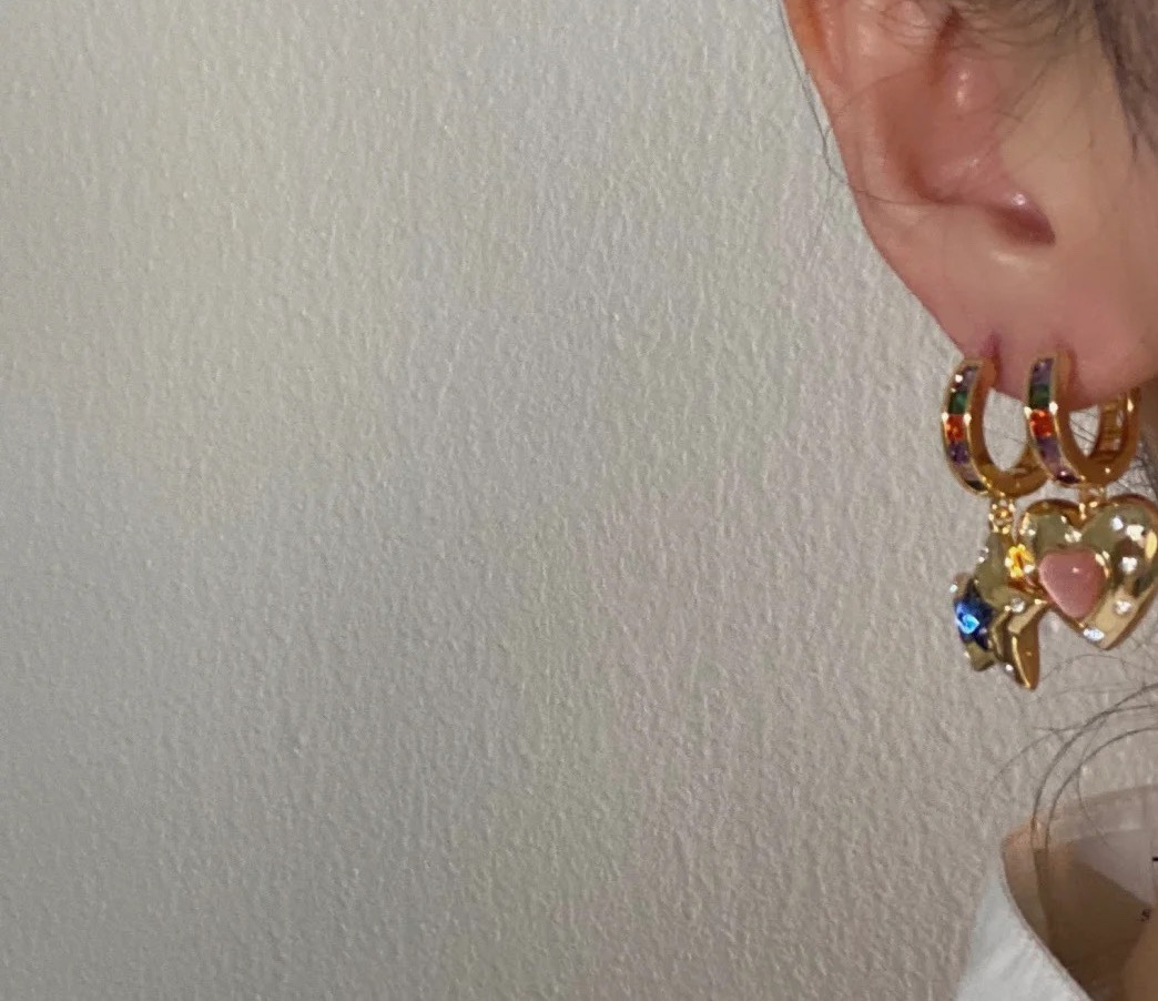 Celine 090045 Heart Star Charm Hoop Earrings earrings gold-tone metal with multicolor rainbow gemstones on hoops pink opal-like heart center blue lapis-like star center clear accent stones 1 5cm hoop diameter 2 5cm total drop length