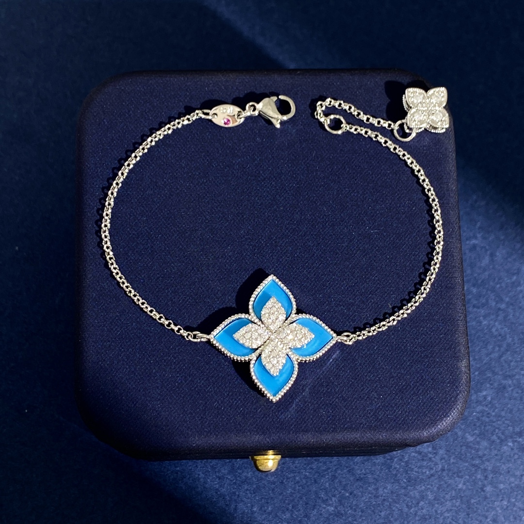 Roberto Coin Princess Flower bracelet Silver-toned white gold with blue enamel and pave white diamonds Yellow gold with green malachite and pave white diamonds Silver-toned white gold with black onyx and pave white diamonds Silver-toned white gold with light blue enamel and pave white diamonds Silver-toned white gold with white mother-of-pearl and pave white diamonds 17cm
