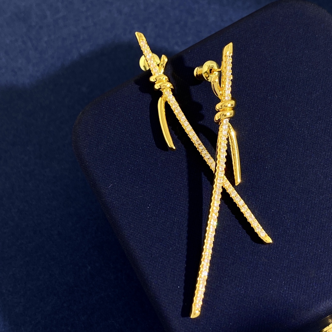 Tiffany Knot earrings available in yellow gold silver rose gold with clear diamond pave 6 5cm length