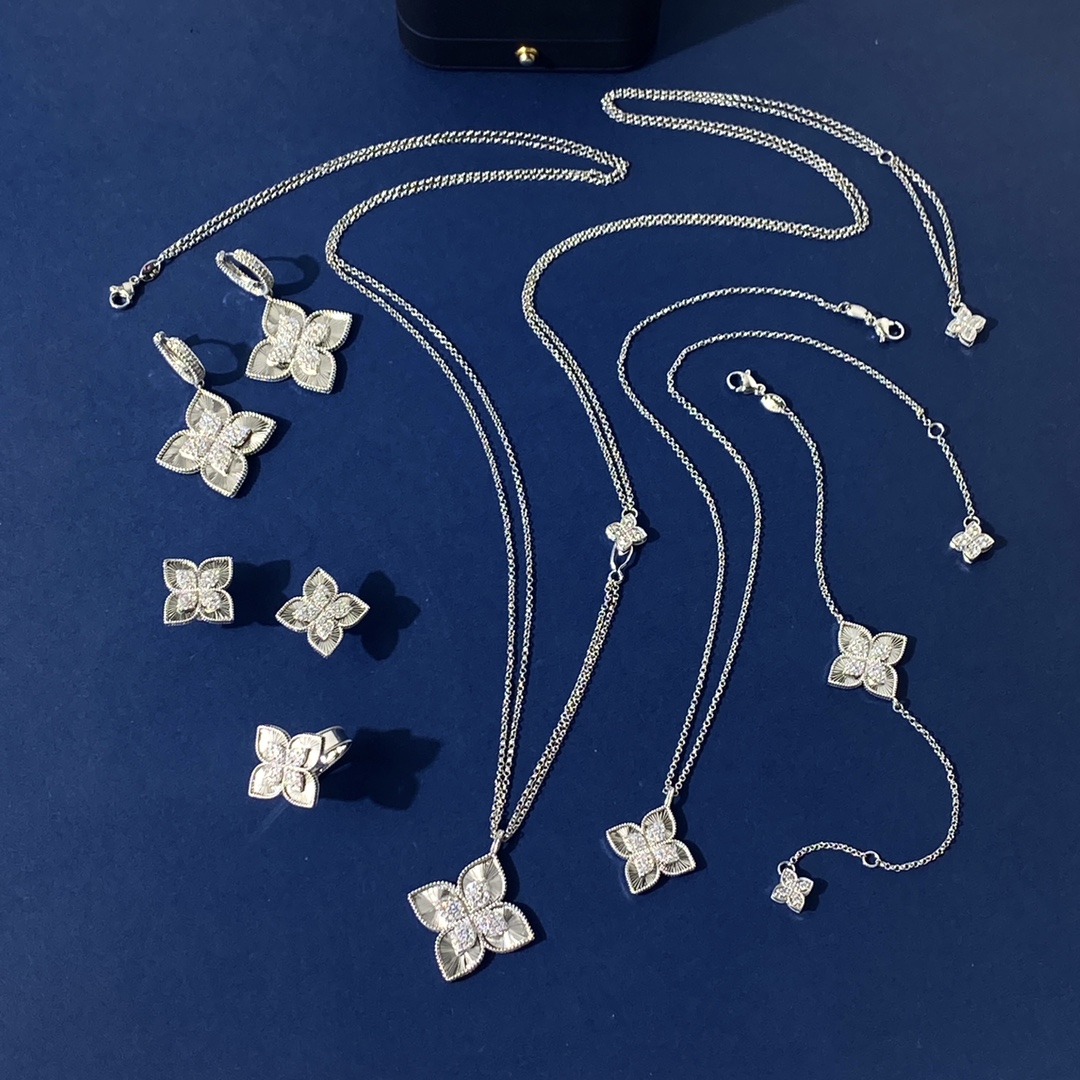 Van Cleef Arpels Vintage Alhambra earrings 18K yellow gold with clear diamond accents 18K white gold with clear diamond accents One Size