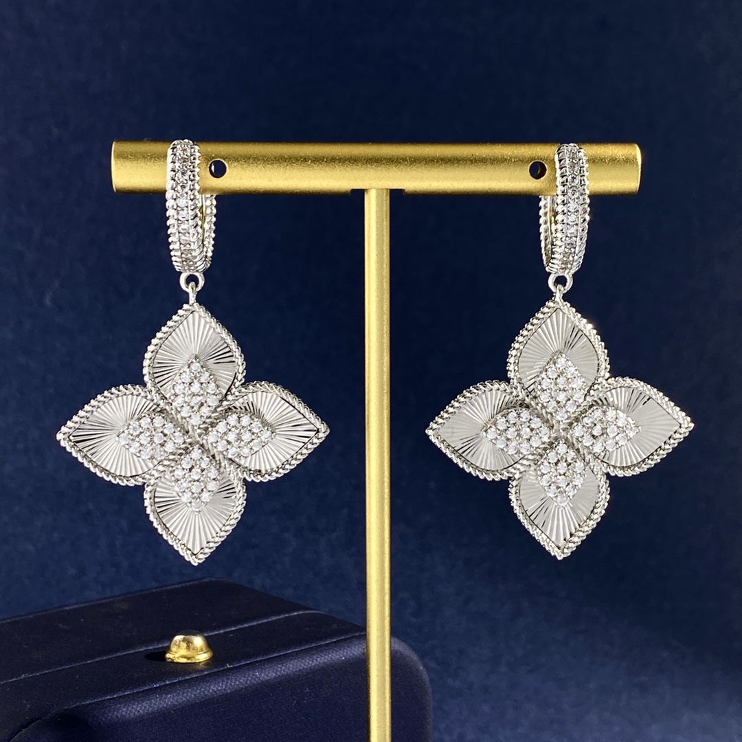 Van Cleef Arpels Vintage Alhambra earrings 18K yellow gold with clear diamond accents 18K white gold with clear diamond accents One Size