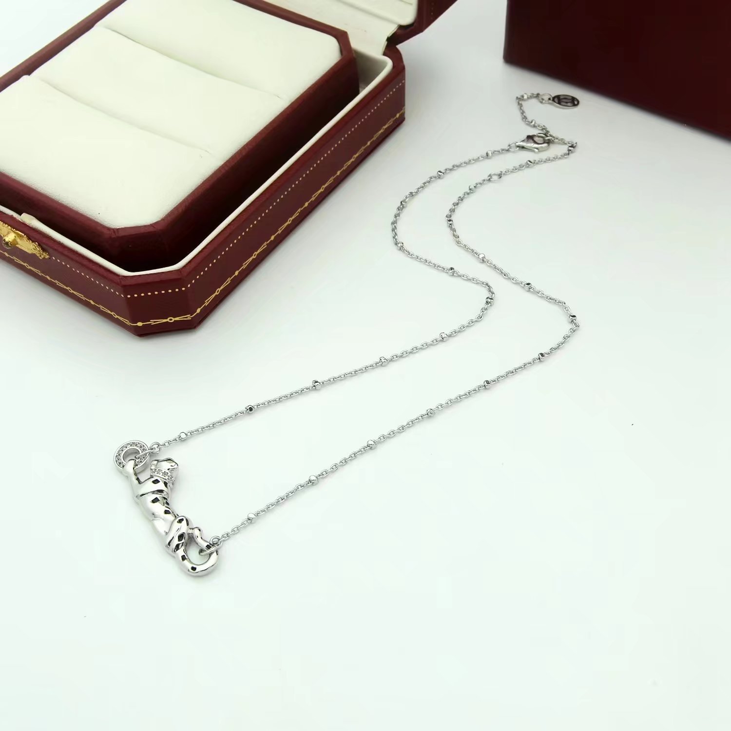 Cartier Panthere de Cartier necklace 18K yellow gold black lacquer spots tsavorite garnet diamond 42cm