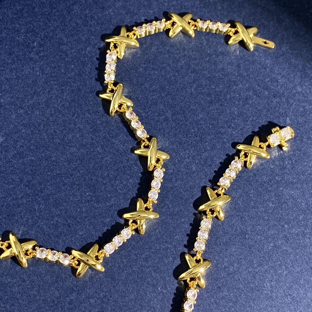 Tiffany X Signature Tennis Bracelet bracelet Gold-toned metal with clear round-cut gemstones Silver-toned metal with clear round-cut gemstones 7 inches