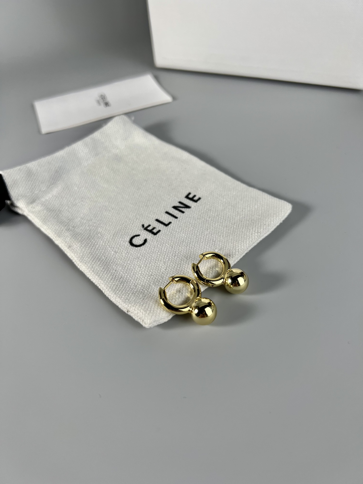 Celine Sphere Detail Small Hoop Earrings earrings gold-tone metal no accent stones 1 2cm hoop diameter