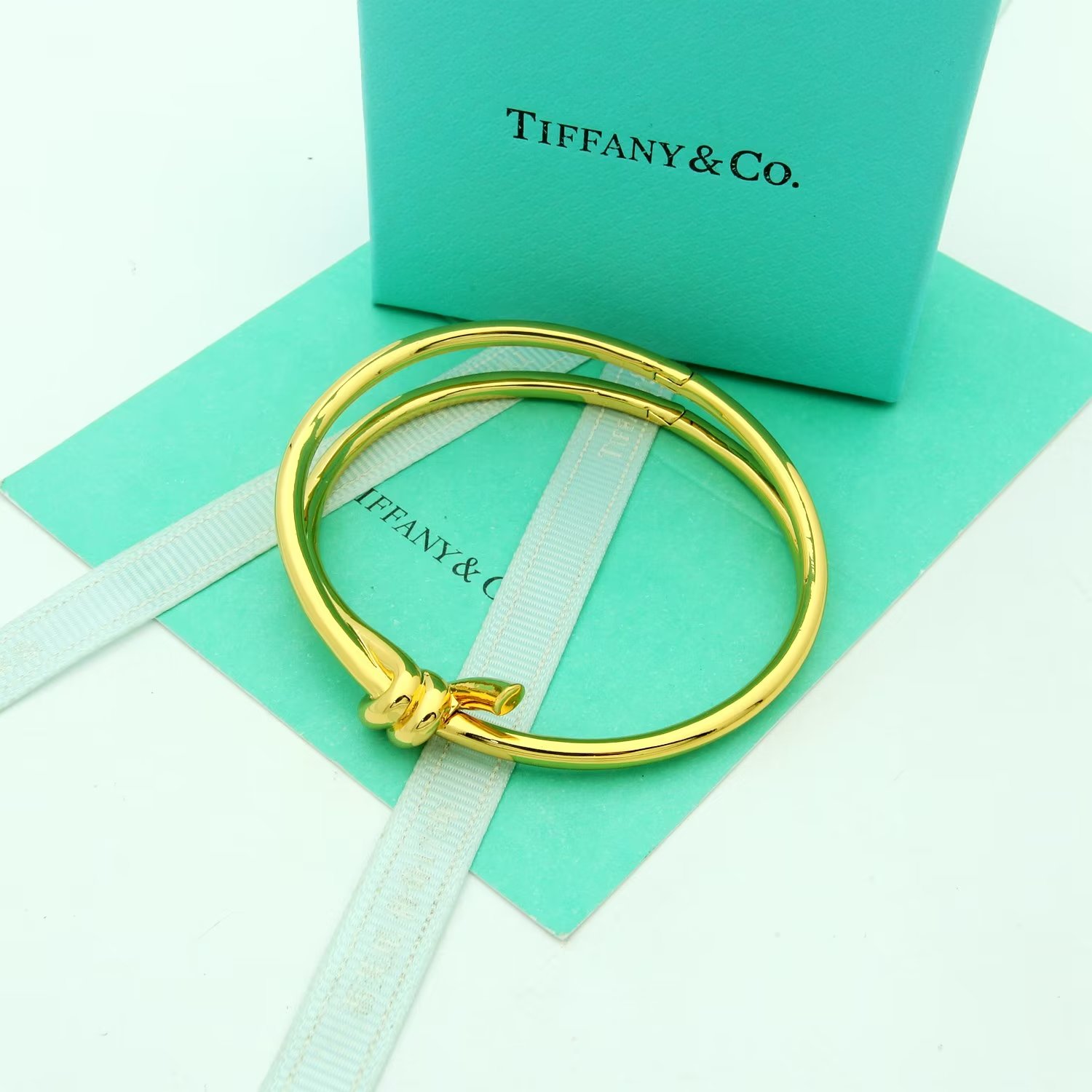 Tiffany Co Tiffany Knot bracelet Available in 18k yellow gold 18k rose gold and sterling silver no gemstones 17cm inner circumference
