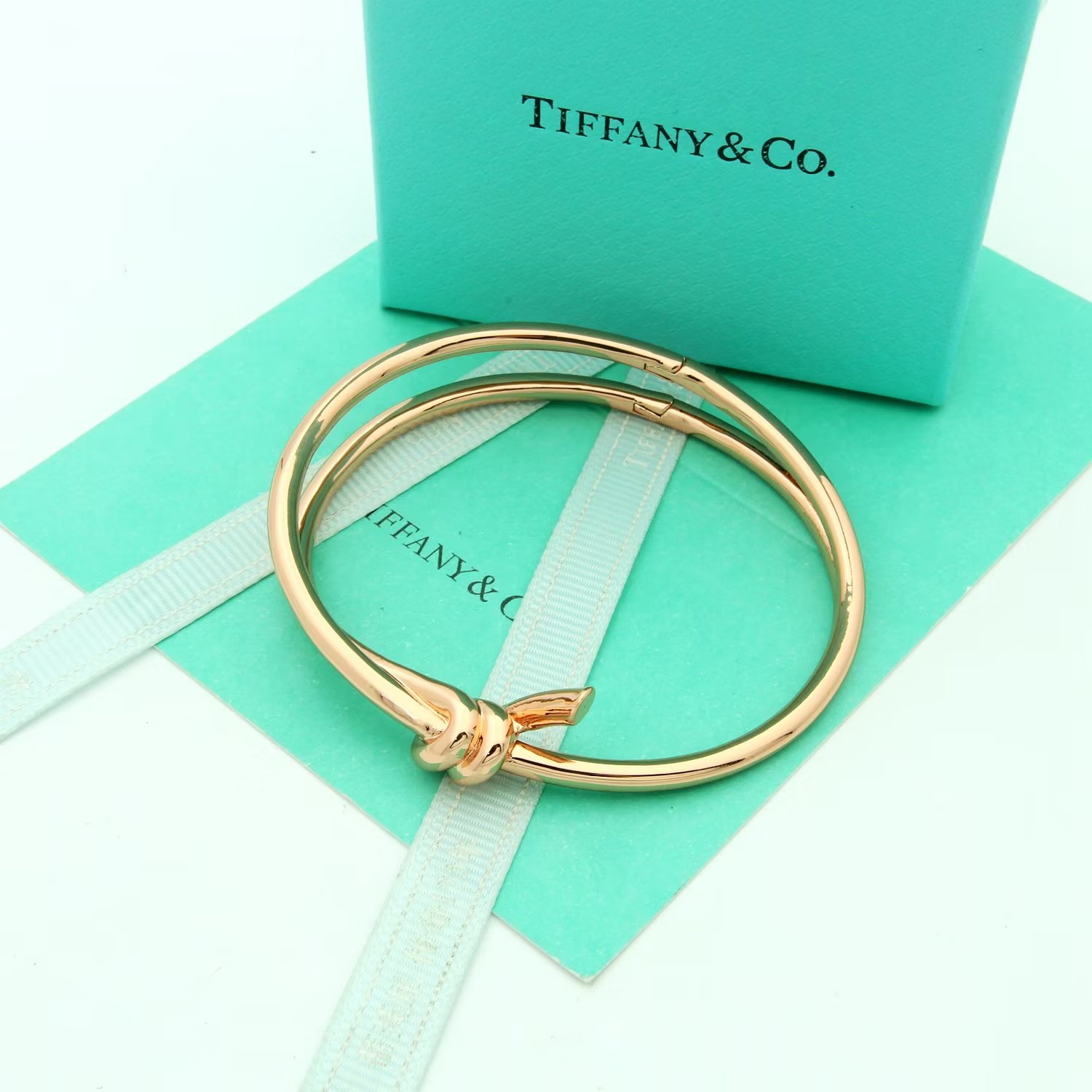 Tiffany Co Tiffany Knot bracelet Available in 18k yellow gold 18k rose gold and sterling silver no gemstones 17cm inner circumference