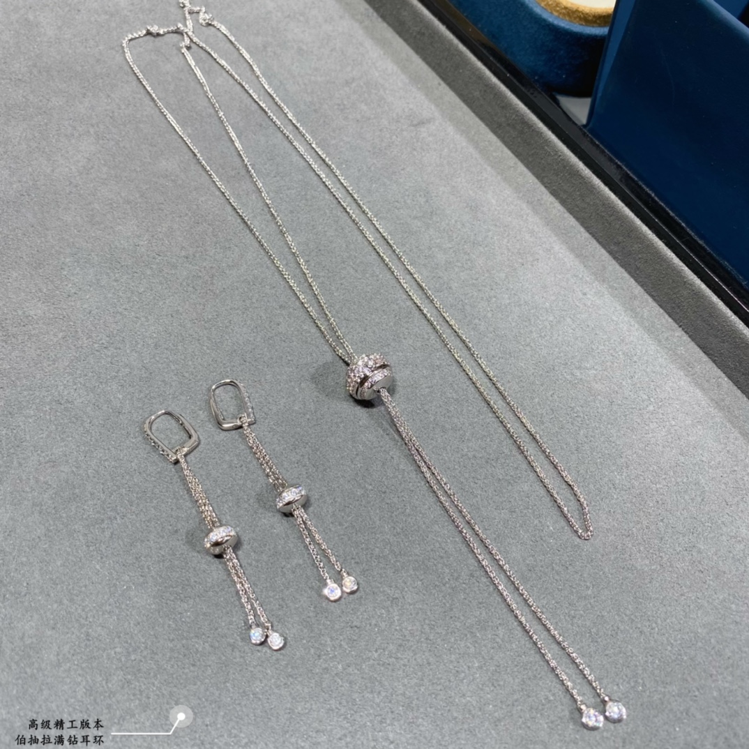 Piaget Possession earrings 18k white gold with clear round diamonds 18k yellow gold with clear round diamonds 4 5cm drop length