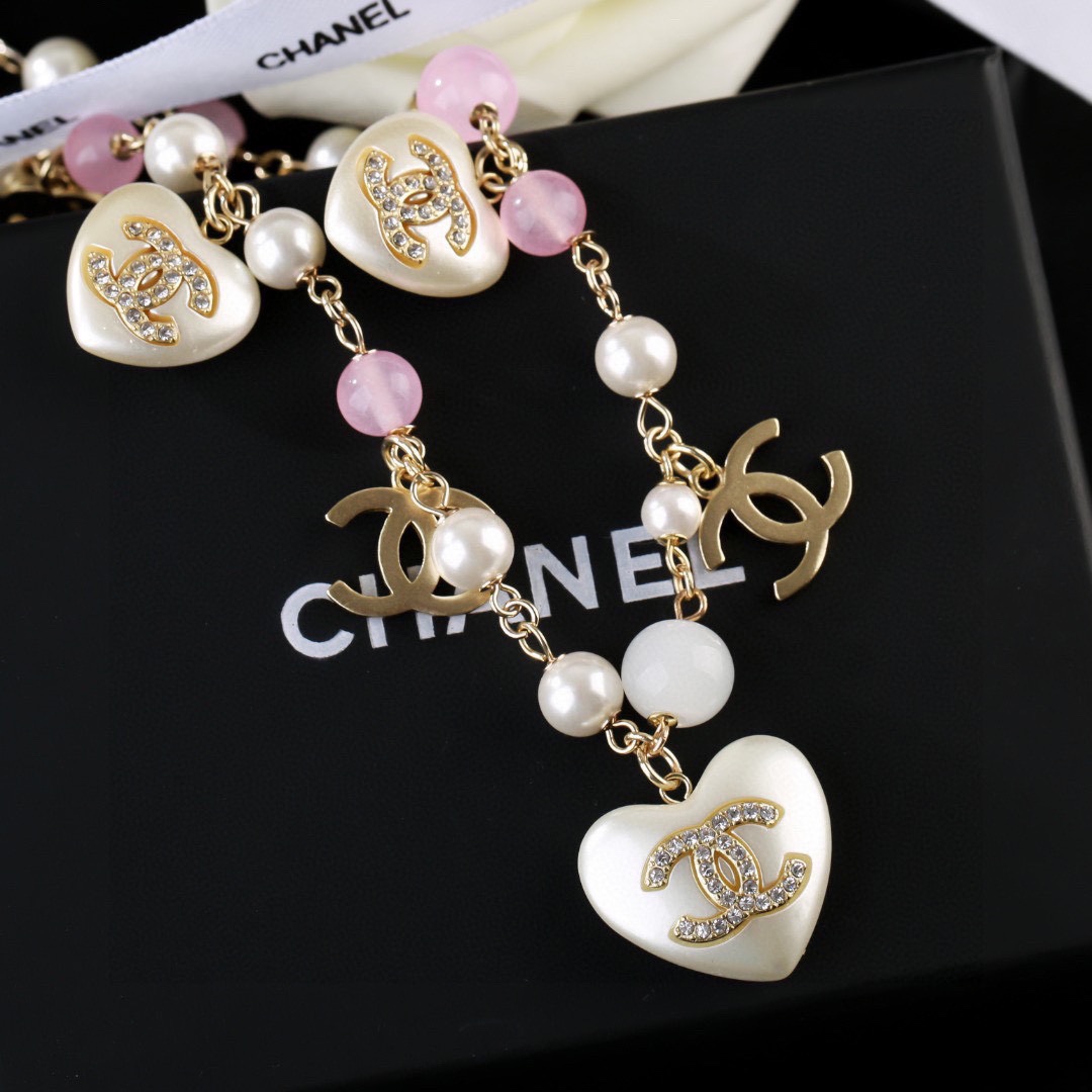 Chanel CC Heart Pearl Bead Long Chain necklace Gold-tone metal white faux pearl pink translucent bead white resin heart charm with crystal CC logo 80cm