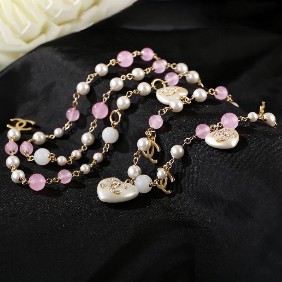 Chanel CC Heart Pearl Bead Long Chain necklace Gold-tone metal white faux pearl pink translucent bead white resin heart charm with crystal CC logo 80cm