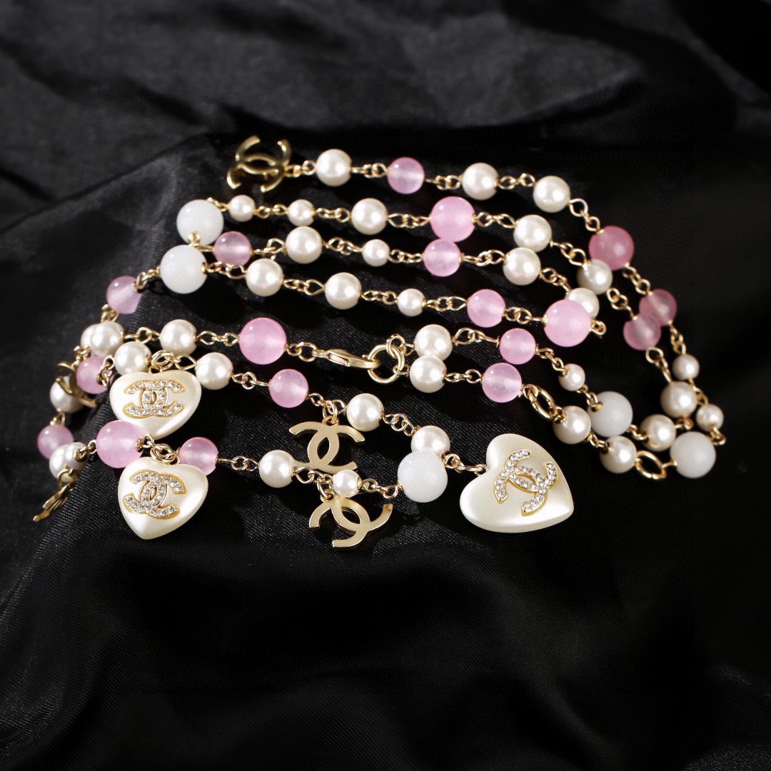 Chanel CC Heart Pearl Bead Long Chain necklace Gold-tone metal white faux pearl pink translucent bead white resin heart charm with crystal CC logo 80cm