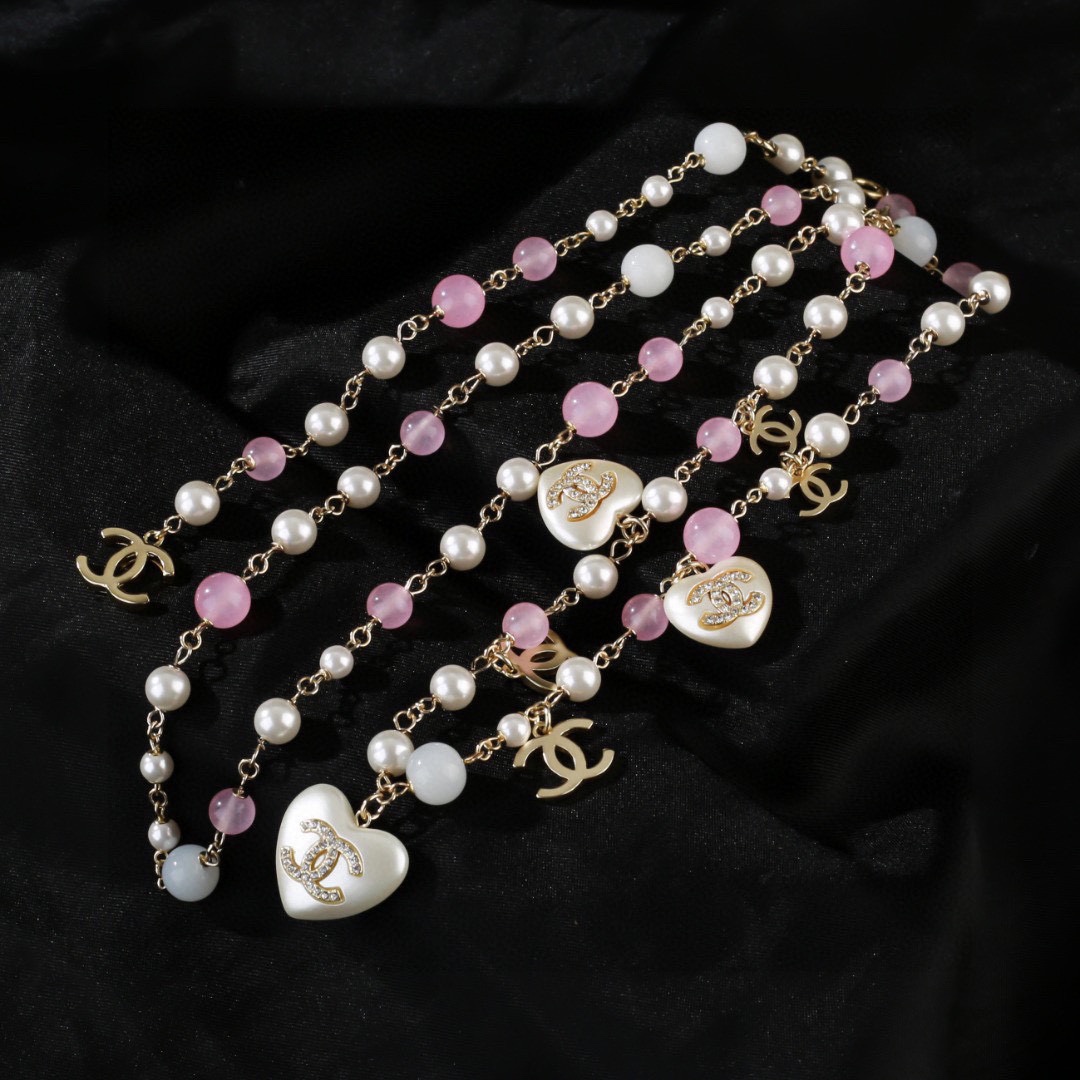 Chanel CC Heart Pearl Bead Long Chain necklace Gold-tone metal white faux pearl pink translucent bead white resin heart charm with crystal CC logo 80cm