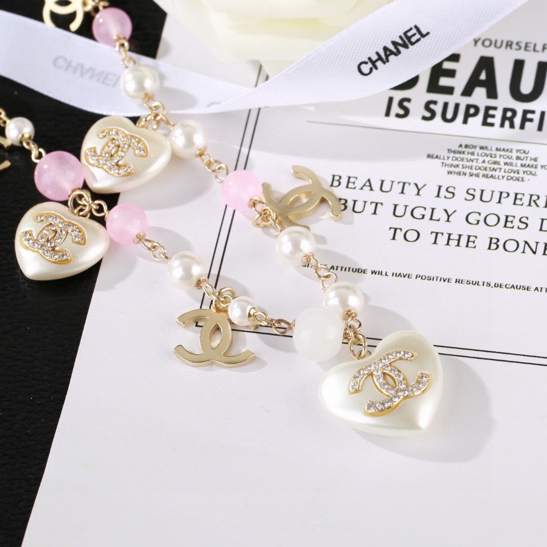 Chanel CC Heart Pearl Bead Long Chain necklace Gold-tone metal white faux pearl pink translucent bead white resin heart charm with crystal CC logo 80cm