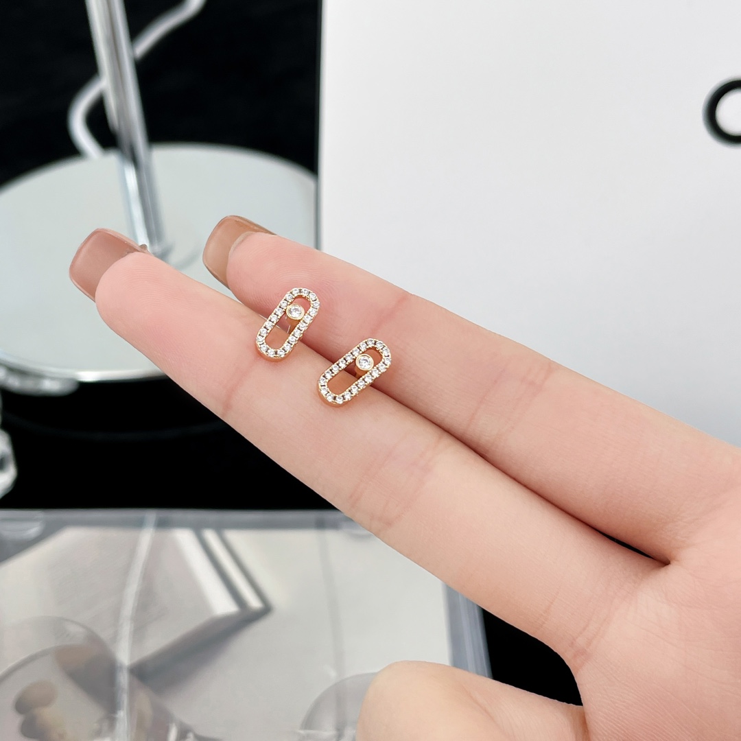 Messika Move Uno earrings Yellow gold with clear pave diamonds and central moving diamond 10mm stud length