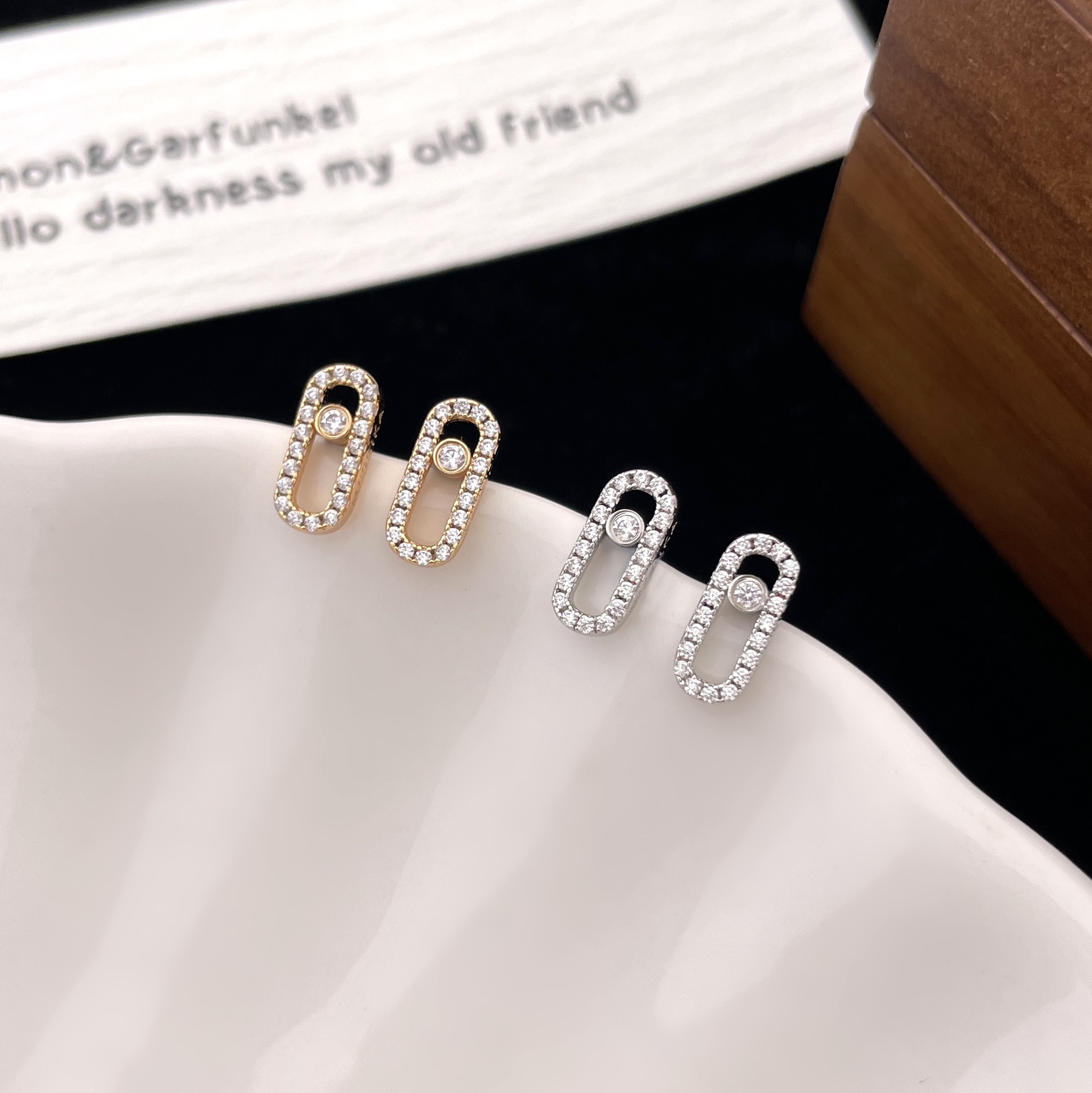 Messika Move Uno earrings Yellow gold with clear pave diamonds and central moving diamond 10mm stud length
