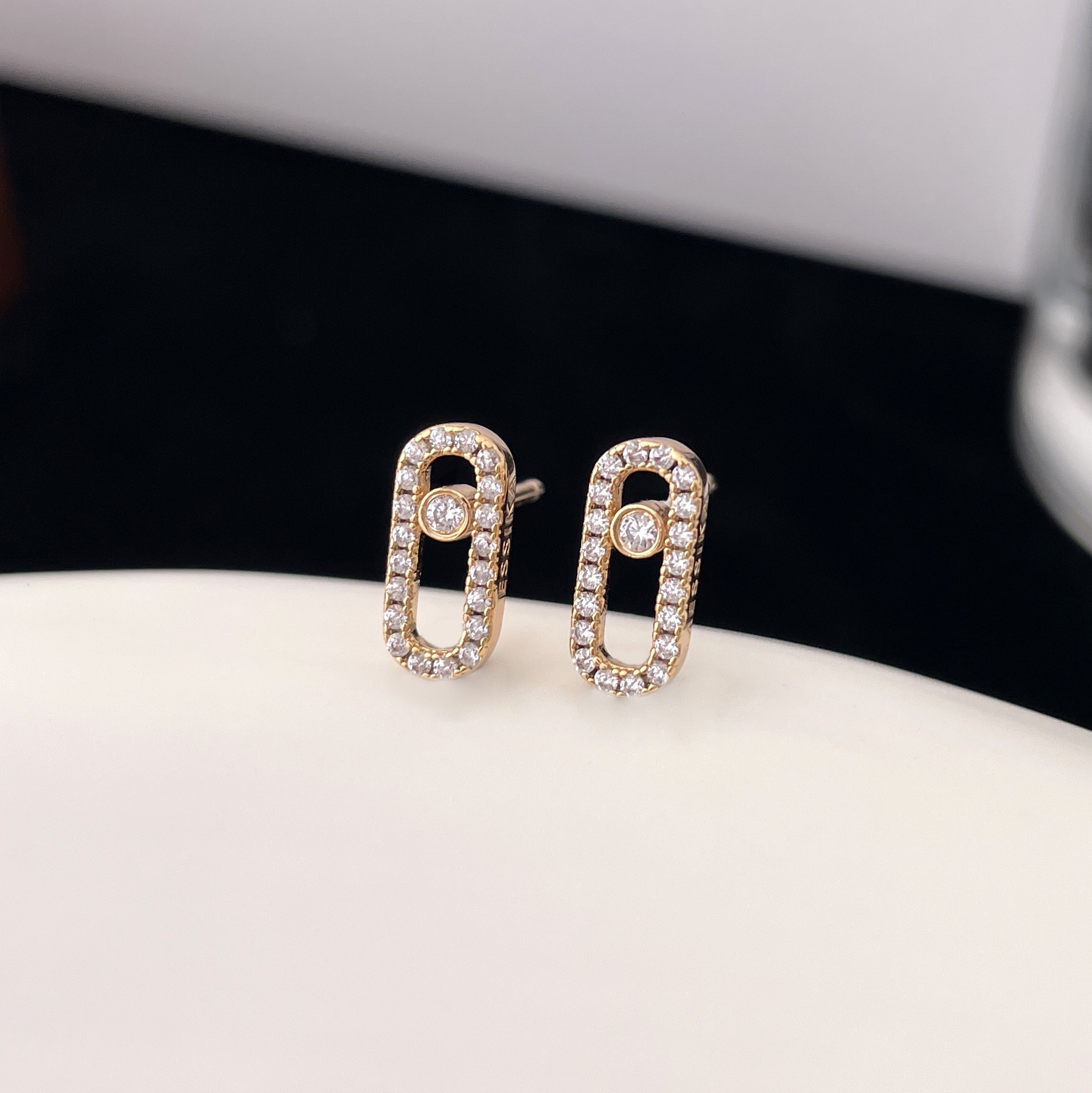 Messika Move Uno earrings Yellow gold with clear pave diamonds and central moving diamond 10mm stud length