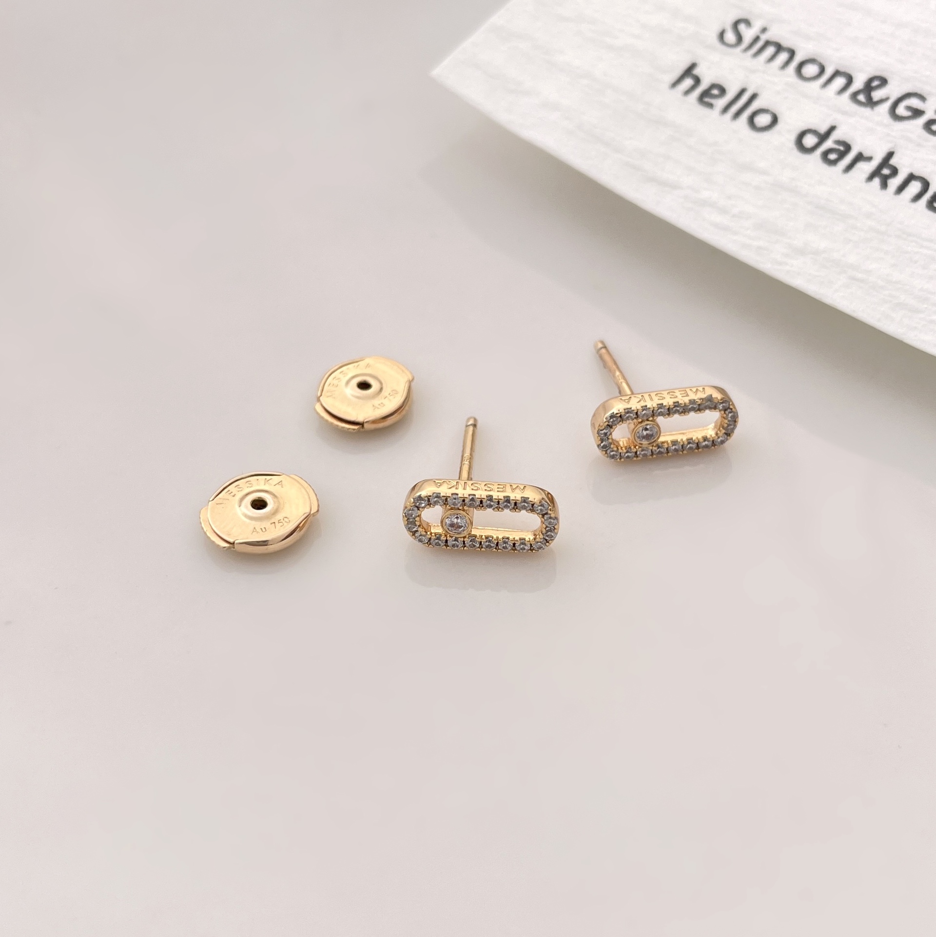Messika Move Uno earrings Yellow gold with clear pave diamonds and central moving diamond 10mm stud length