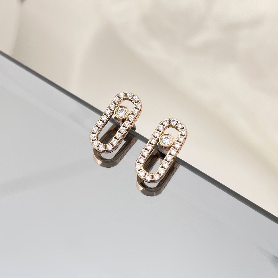 Messika Move Uno earrings Yellow gold with clear pave diamonds and central moving diamond 10mm stud length